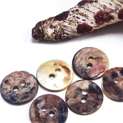 Botones de concha de colores láser